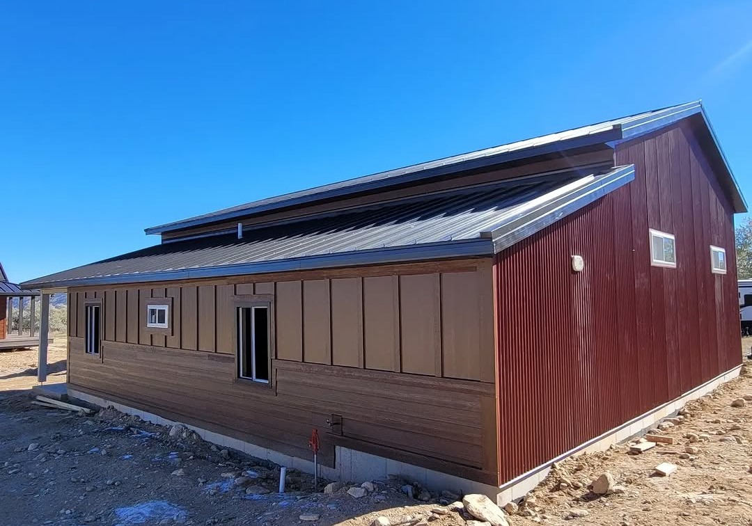 Custom metal roof installed on a cabin by Omega Metals